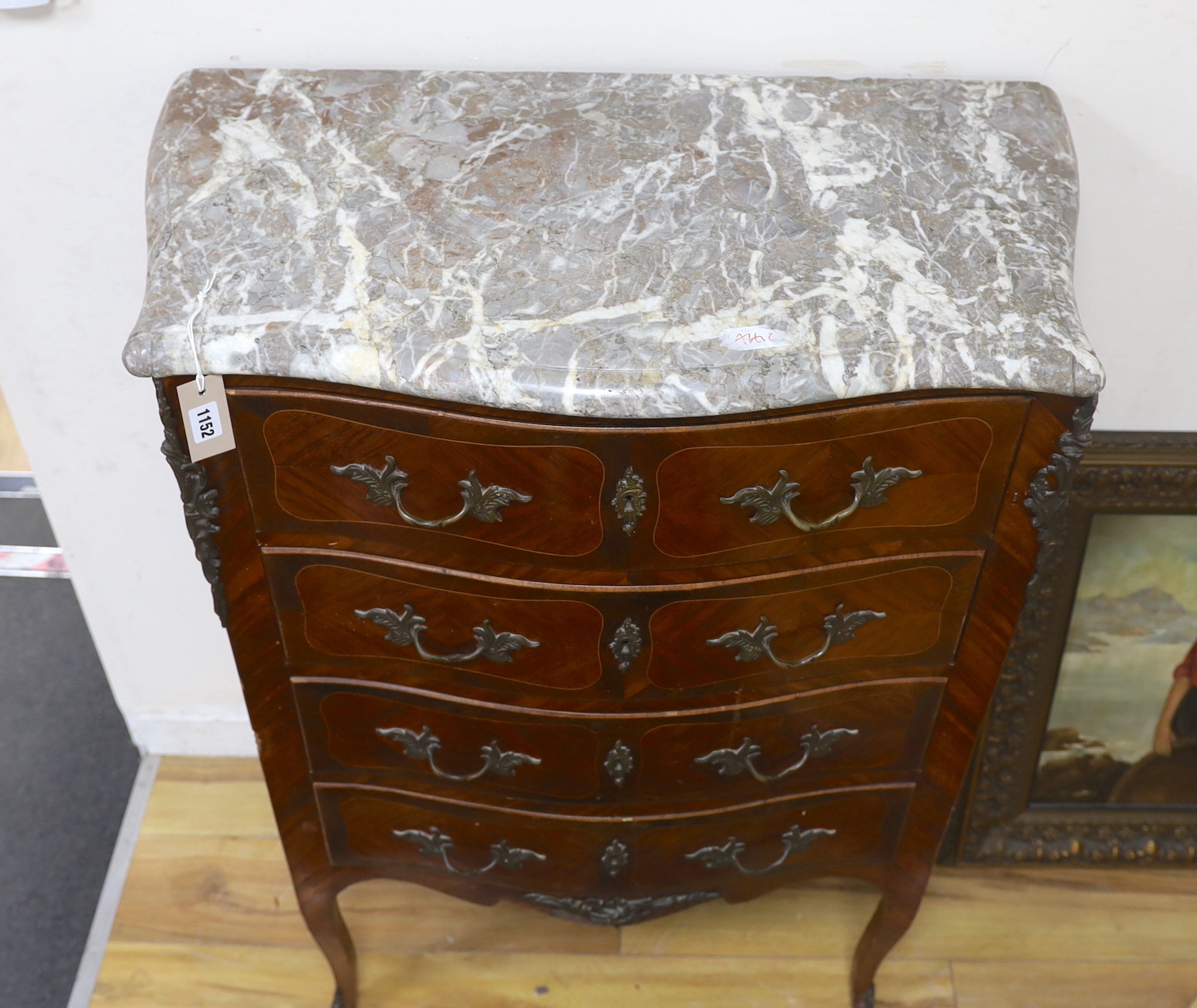 A Louis XVI style marble topped serpentine kingwood four drawer chest, width 82cm, depth 44cm, height 115cm
